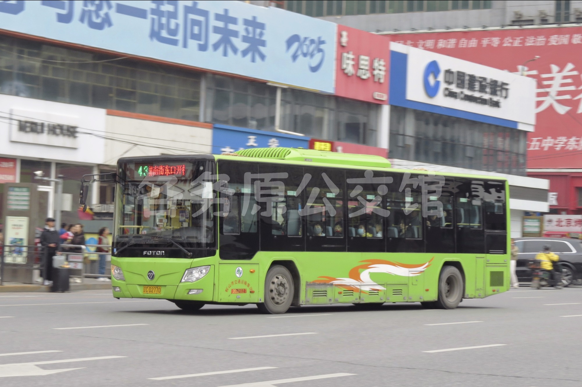 52027